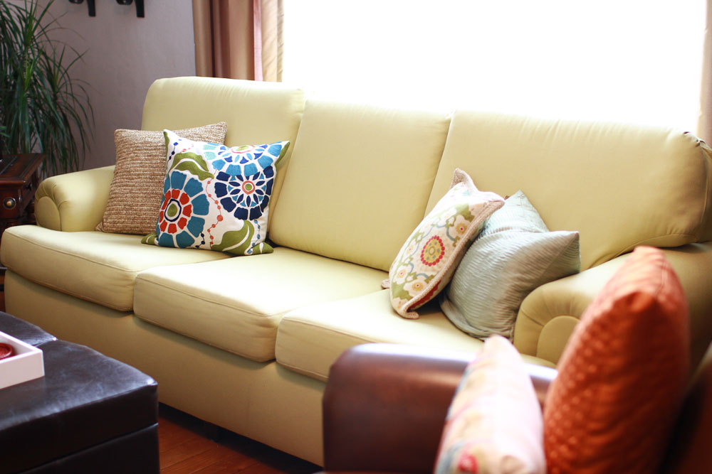 Light upholstered sofa with patterned pillows, original Forte residential work